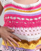 Colorful crochet top with a pattern of pink, yellow, and white.