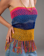 Colorful crochet top with fringes on a neutral background